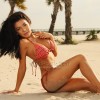 Swimsuit model Catherine, on a beach, for a bikini calendar.